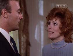 Edward Woodward and Jill St. John in Sitting Target